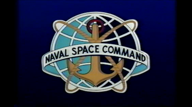 Naval Space Command emblem showing Earth enclosed within orbital rings against a dark space background