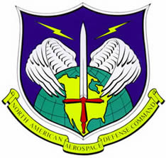 Official NORAD emblem showing a sword with energy bolts and wing-like orbital rings around the Earth