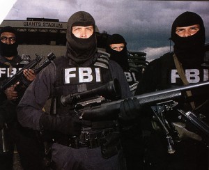 FBI agents conducting a raid operation in tactical gear