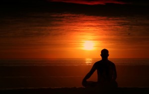 Person practicing meditation in a peaceful relaxation pose