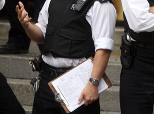 Accidental Leak: UK Policeman’s Clipboard Reveals Julian Assange Arrest Tactics