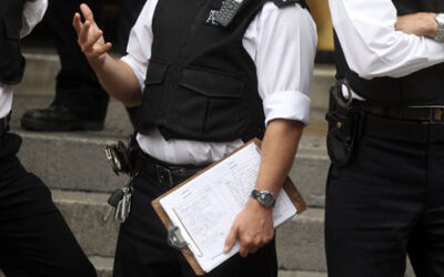 UK Police Clipboard Accidentally Reveals Julian Assange Arrest Strategy
