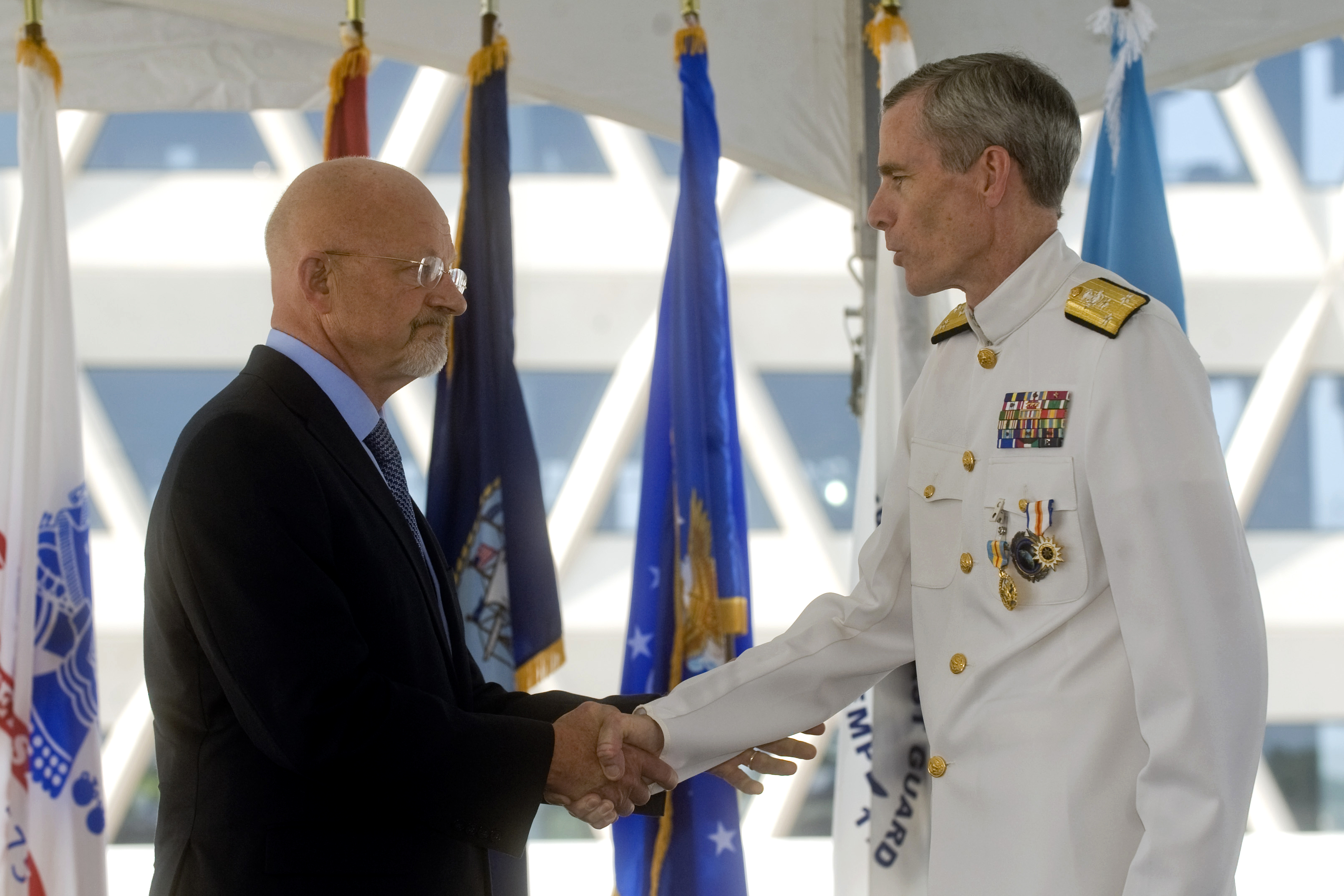 Director of National Intelligence James Clapper shaking hands at an official meeting